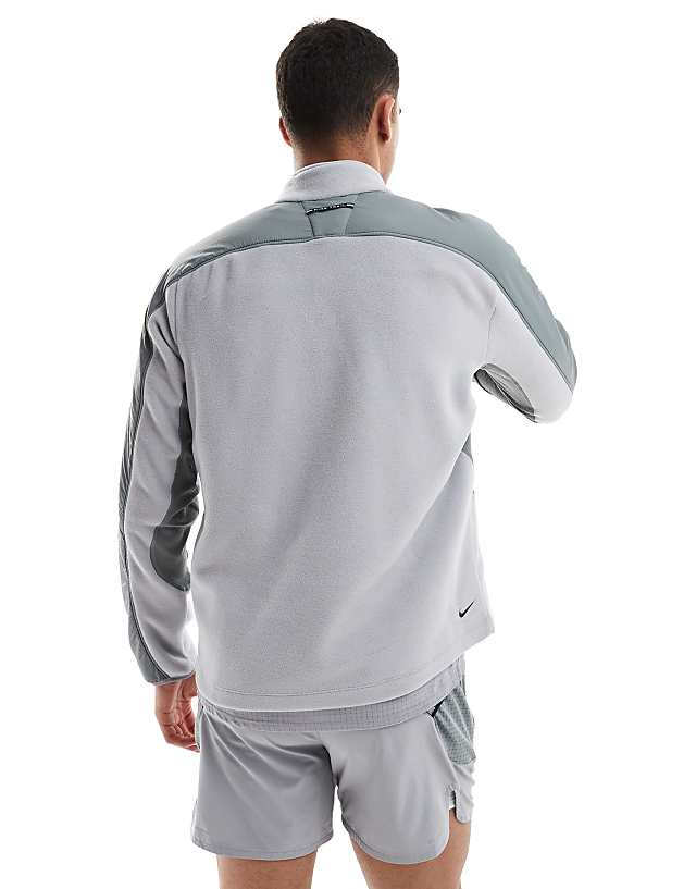 Asos Nike Running Trail Polartec 1/4 Zip Fleece In Grey