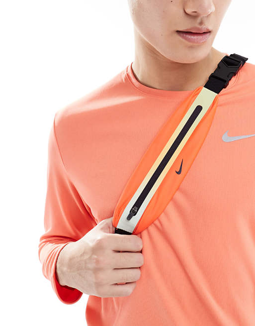 asos Nike slim waist pack 3.0 in bright crimson and cave purple