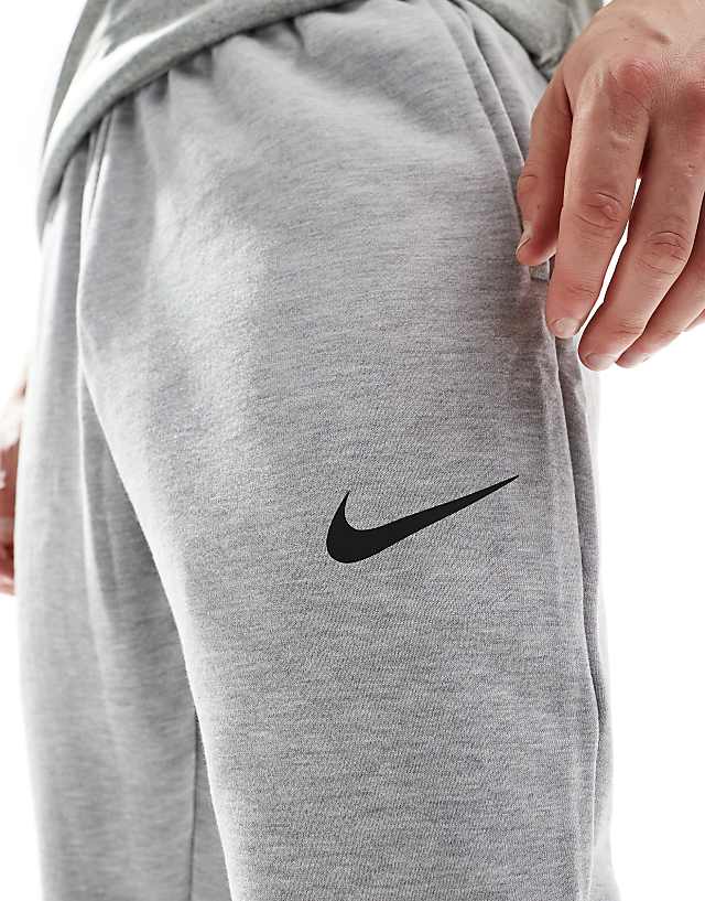 Asos Nike Training Dri-FIT Tapered Fleece Joggers In Grey