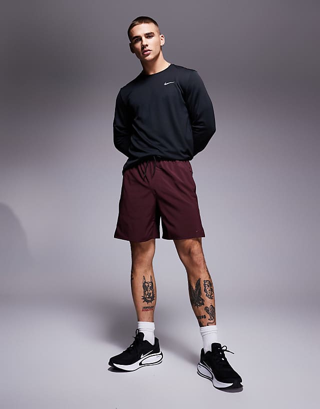 asos Nike Training Dri-Fit Unlimited woven 7 inch shorts in burgundy