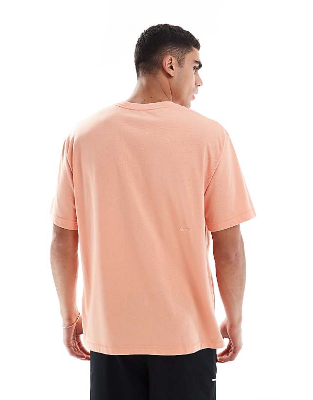 Asos Nike Training Heritage Dri-FIT T-shirt In Orange