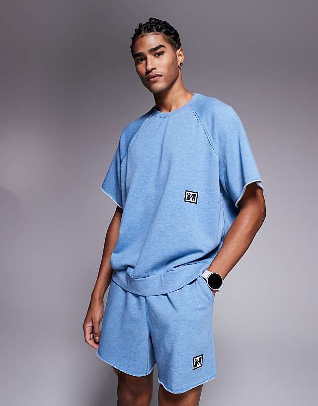 asos Nike Training Heritage fleece short sleeve top in blue