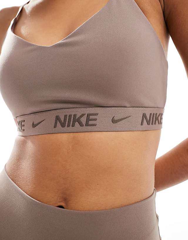 Asos Nike Training Indy Dri-FIT Light Support Sports Bra In Brown