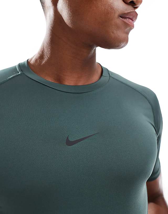 Asos Nike Training Pro Tight Short Sleeve Top In Green