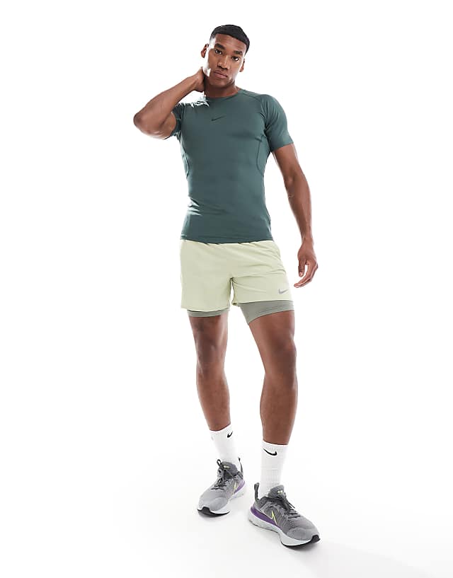 Asos Nike Training Pro Tight Short Sleeve Top In Green