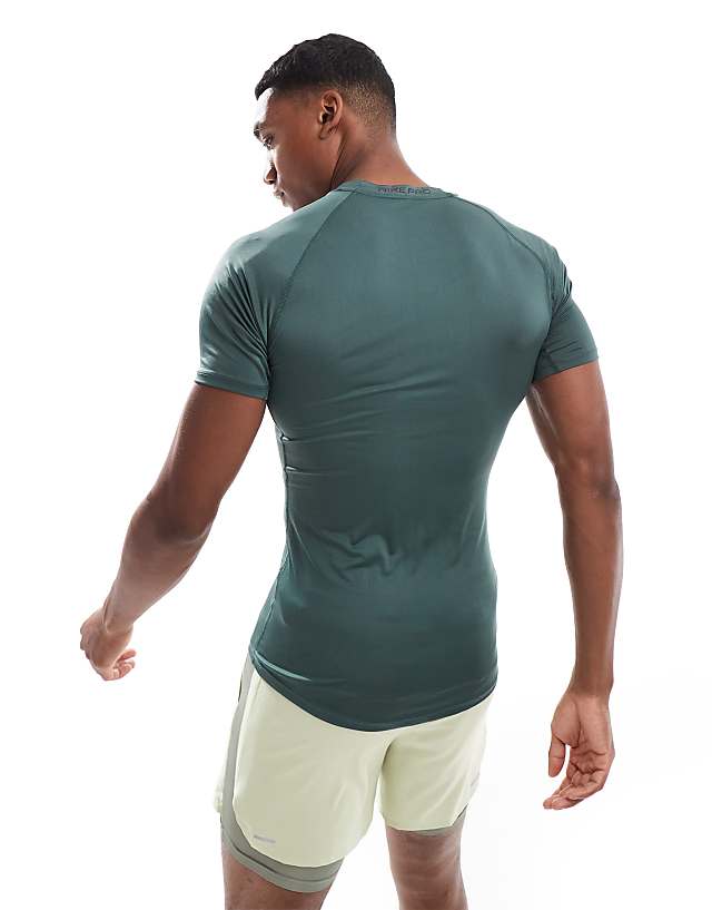 Asos Nike Training Pro Tight Short Sleeve Top In Green