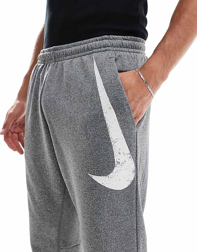 Asos Nike Training Swoosh Graphic Tapered Joggers In Grey