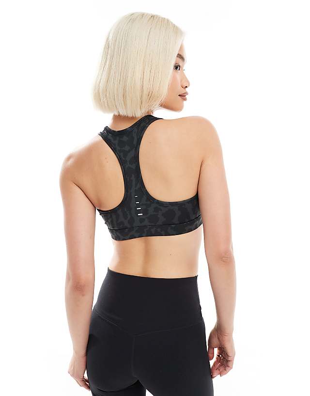 Asos Nike Training Swoosh Leopard Print Medium Support Sports Bra In Black