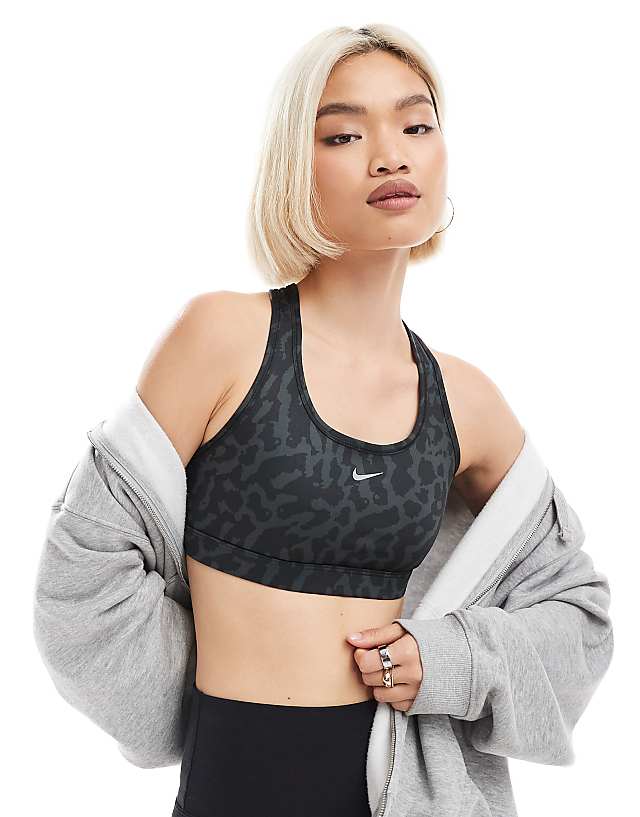 asos Nike Training Swoosh Leopard Print medium support sports bra in black