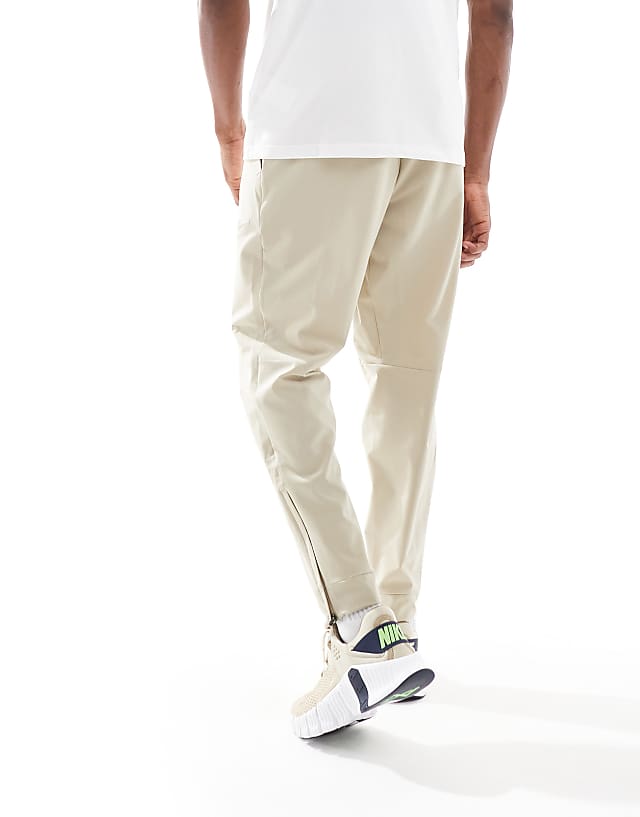 Asos Nike Training Unlimited Dri-FIT Track Trouser In Beige
