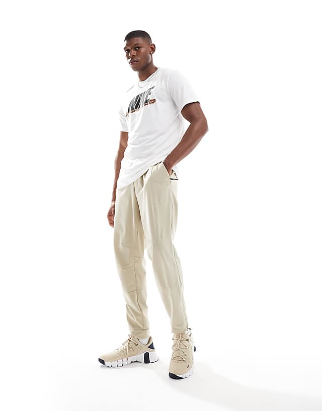 asos Nike Training Unlimited Dri-FIT track trouser in beige