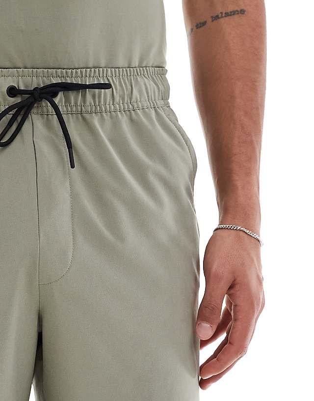 Asos Nike Training Unlimited Dri-FIT Woven 9inch Shorts In Light Green