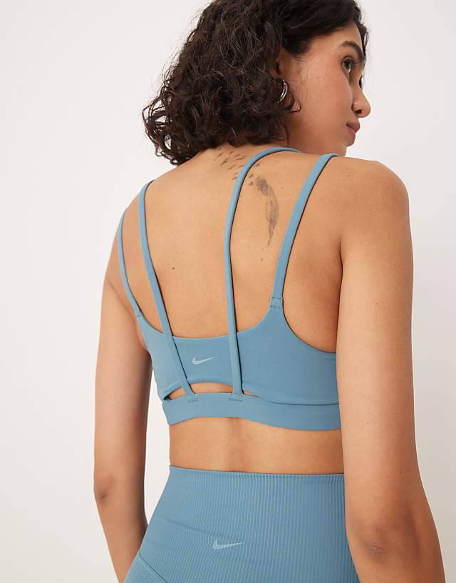 Asos Nike Training Zenvy Dri-FIT Soft Touch Alate Light Support Sports Bra In Blue