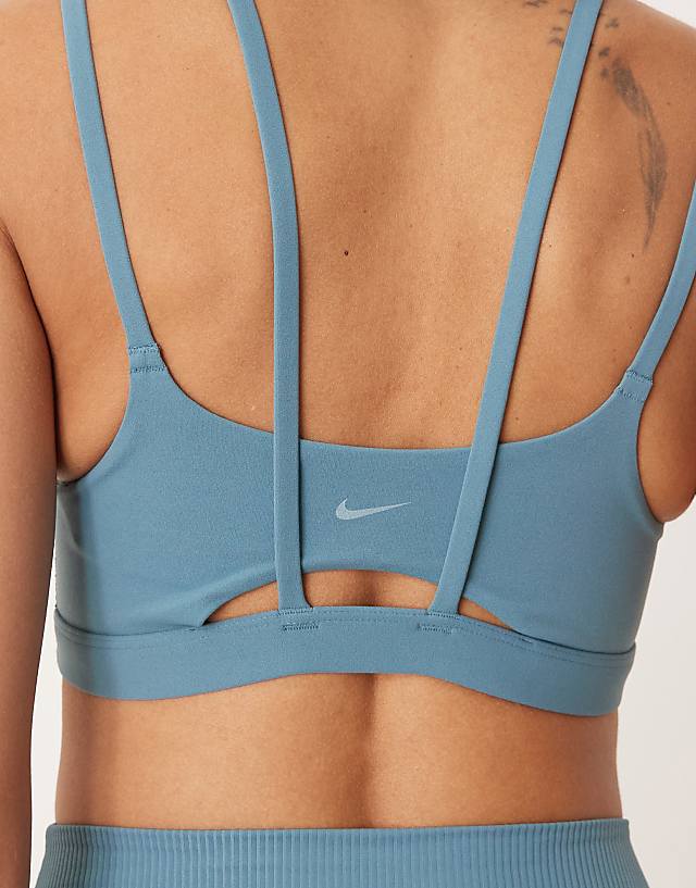 Asos Nike Training Zenvy Dri-FIT Soft Touch Alate Light Support Sports Bra In Blue