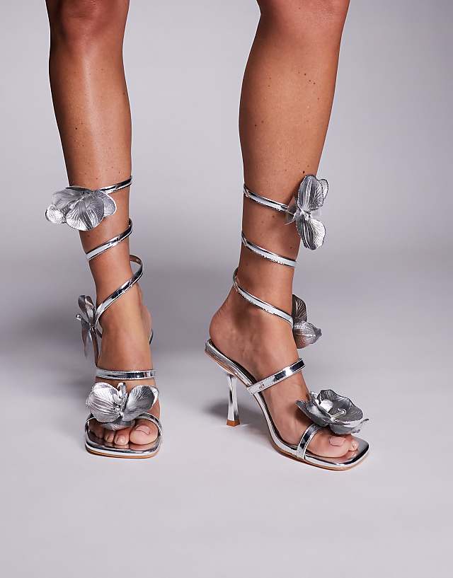 asos Public Desire Lotus Flower Trim Wrap Around Flared Stiletto High Heels in silver
