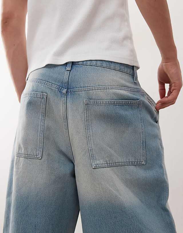 Asos Reclaimed Vintage Oversized Longline Denim Jort In Light Blue Faded Wash