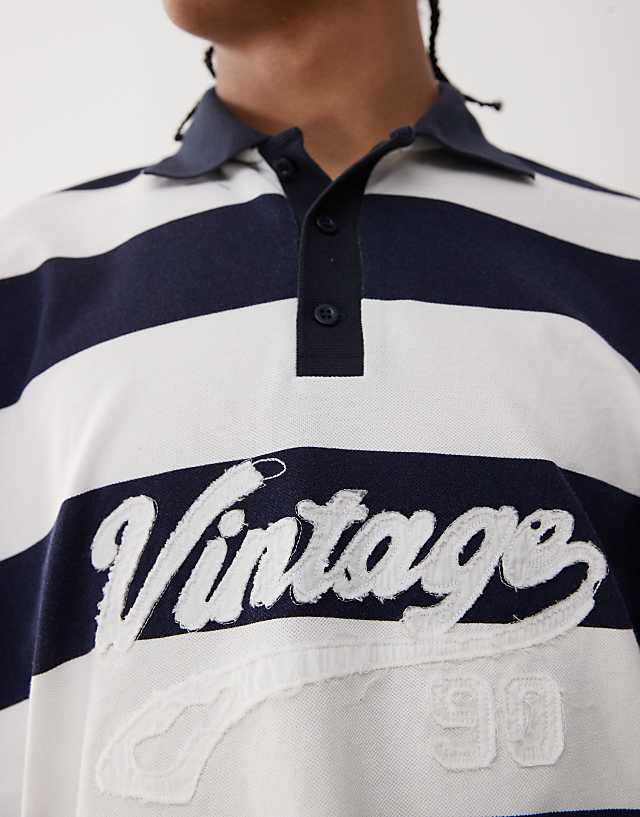 Asos Reclaimed Vintage Stripe Pique Polo Shirt With Graphic In Navy