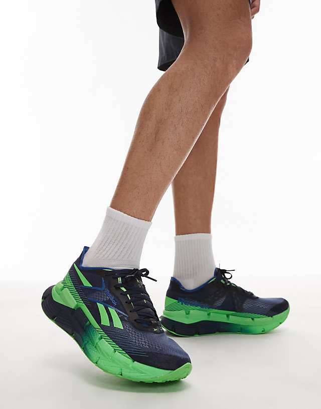 asos Reebok Zignition running trainers in navy and green