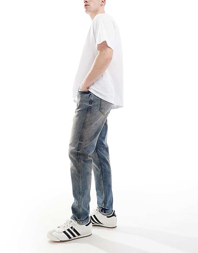 Asos River Island Tapered Fit Jeans In Midwash Blue