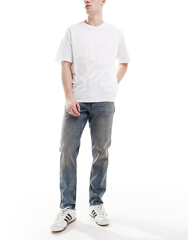 asos River Island tapered fit jeans in midwash blue
