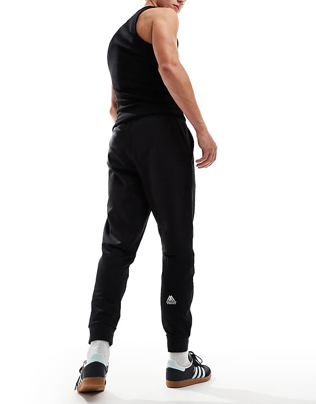 Asos The North Face Mountain Athletics Logo Joggers In Black
