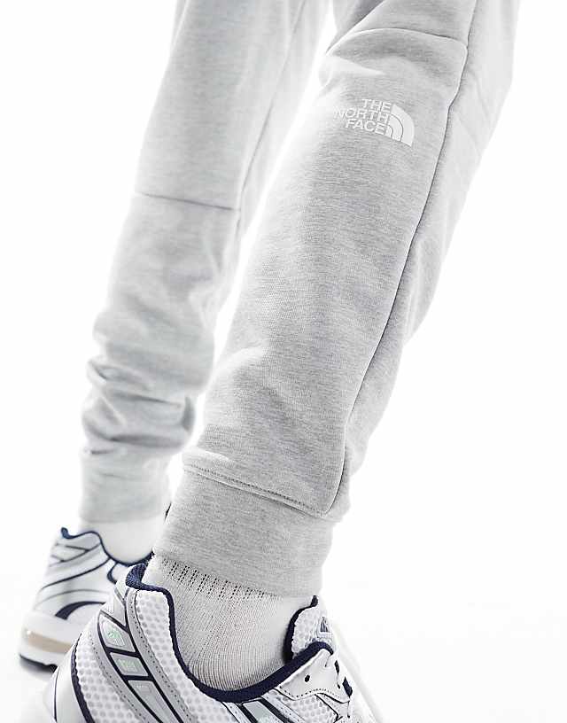 Asos The North Face Training Reaxion Fleece Joggers In Grey