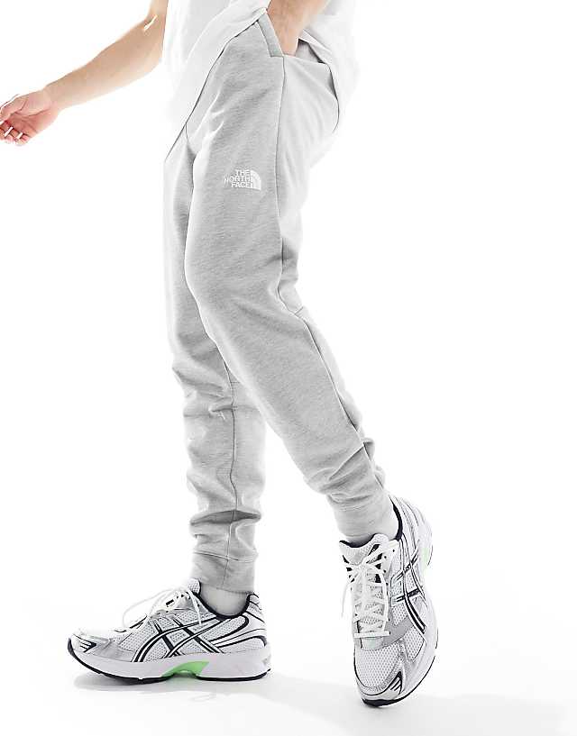 Asos The North Face Training Reaxion Fleece Joggers In Grey