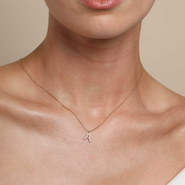 Astrid & Miyu A Initial Pavé Pendant Necklace In Gold