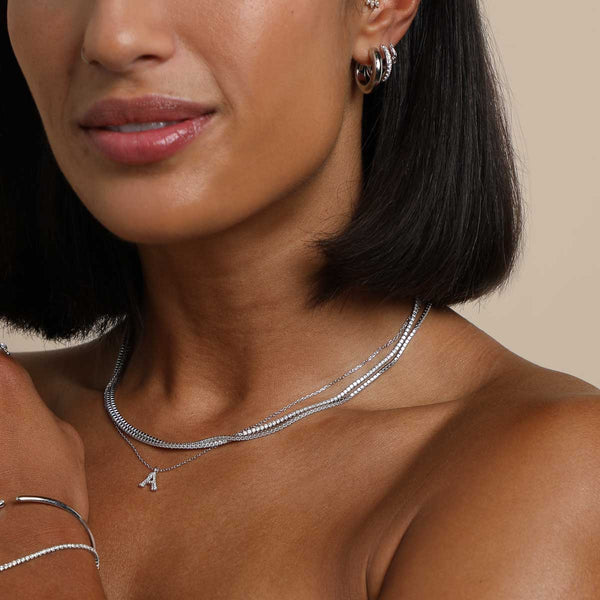 Astrid & Miyu A Initial Pavé Pendant Necklace In Silver