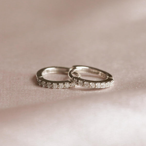 Astrid & Miyu April Birthstone Huggies In Silver With Clear CZ