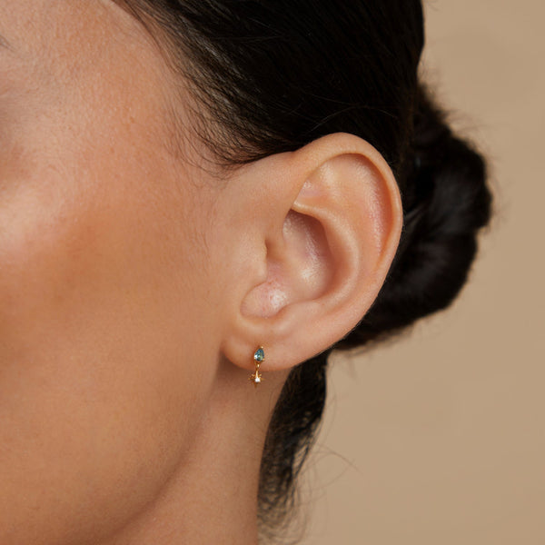 Astrid & Miyu Blue Topaz Star Charm Studs In Gold