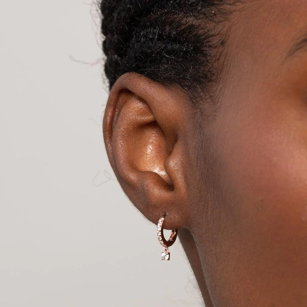 Astrid & Miyu Crystal Charm Huggies In Rose Gold