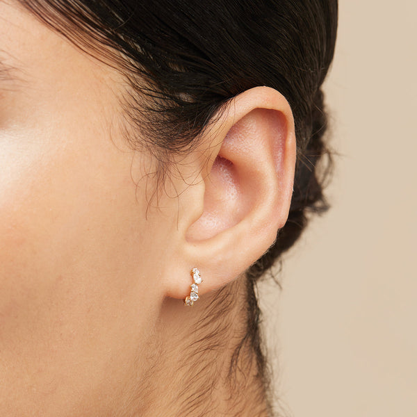 Astrid & Miyu Crystal Pear Huggies In Gold