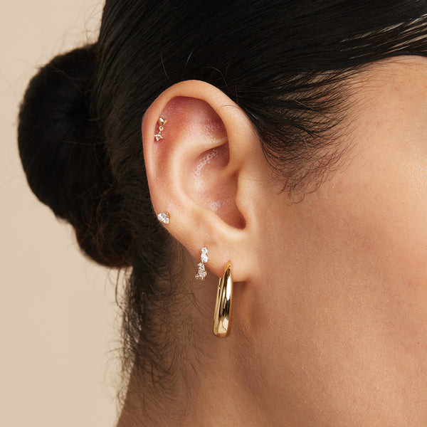 Astrid & Miyu Crystal Pear Huggies In Gold