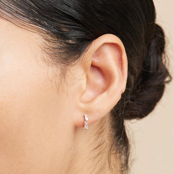 Astrid & Miyu Crystal Pear Huggies In Rose Gold