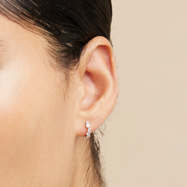 Astrid & Miyu Crystal Pear Huggies In Silver