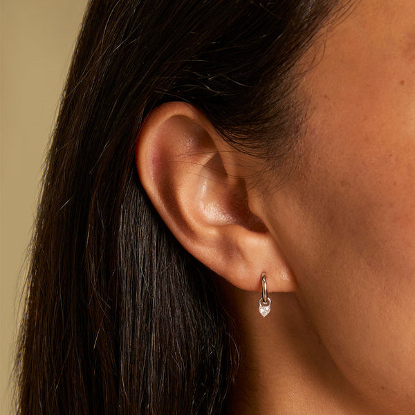 Astrid & Miyu Heart Crystal Charm Huggies In Silver