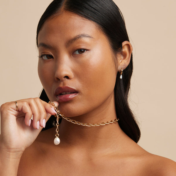 Astrid & Miyu Pearl Charm Huggies In Gold