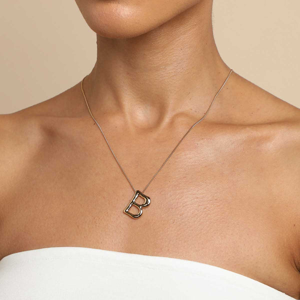 Astrid & Miyu B Initial Bold Pendant Necklace In Gold