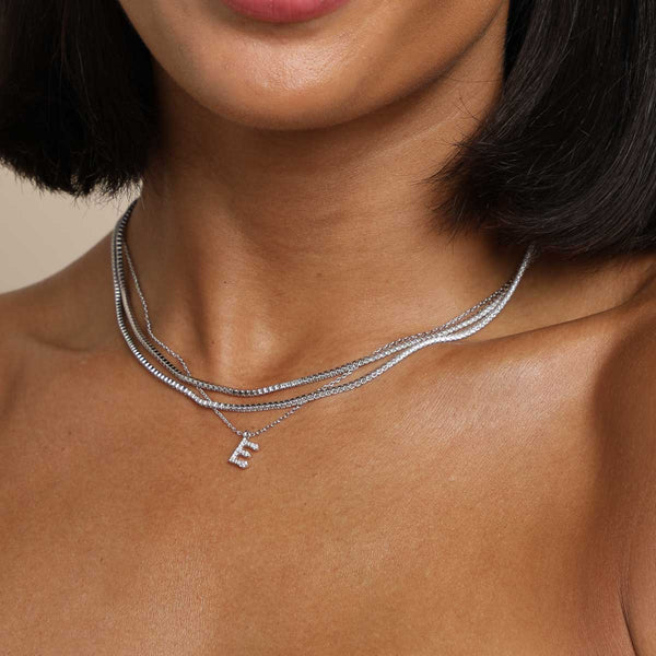Astrid & Miyu E Initial Pavé Pendant Necklace In Silver