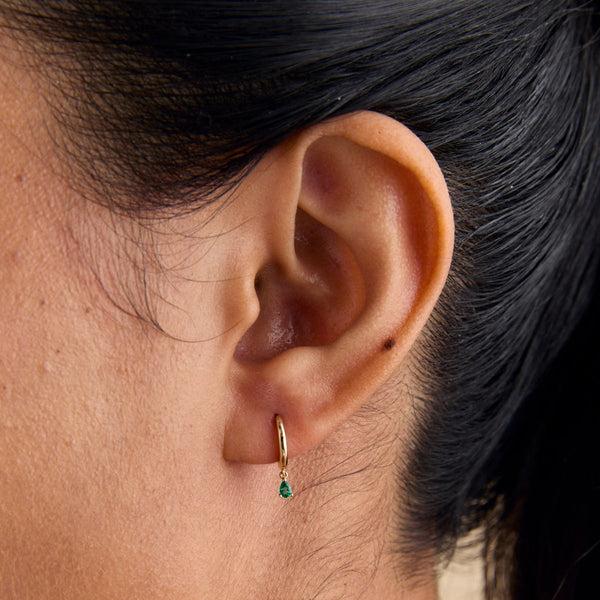 Astrid & Miyu Emerald Pear Charm Huggies In Solid Gold