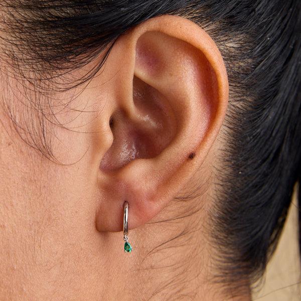 Astrid & Miyu Emerald Pear Charm Huggies In Solid White Gold