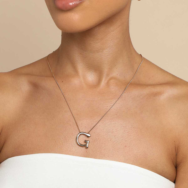 Astrid & Miyu G Initial Bold Pendant Necklace In Gold