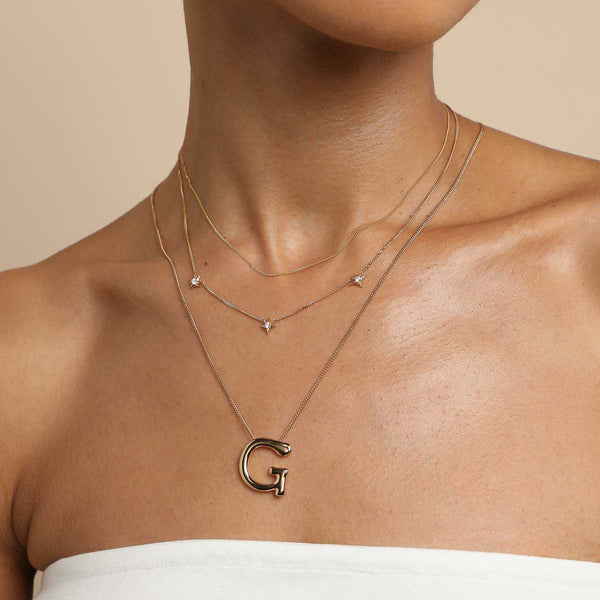 Astrid & Miyu G Initial Bold Pendant Necklace In Gold
