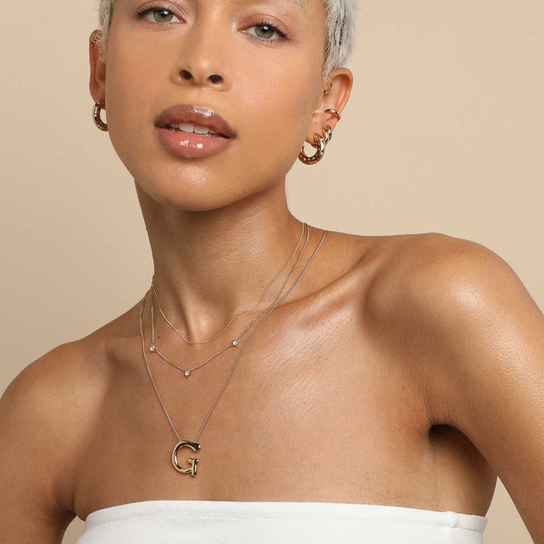 Astrid & Miyu G Initial Bold Pendant Necklace In Gold