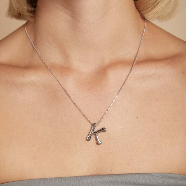 Astrid & Miyu K Initial Bold Pendant Necklace In Silver