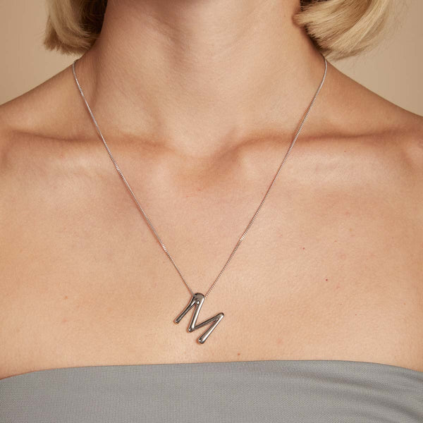 Astrid & Miyu M Initial Bold Pendant Necklace In Silver