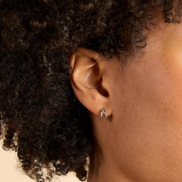 Astrid & Miyu Molten Textured Illusion Huggies In Silver