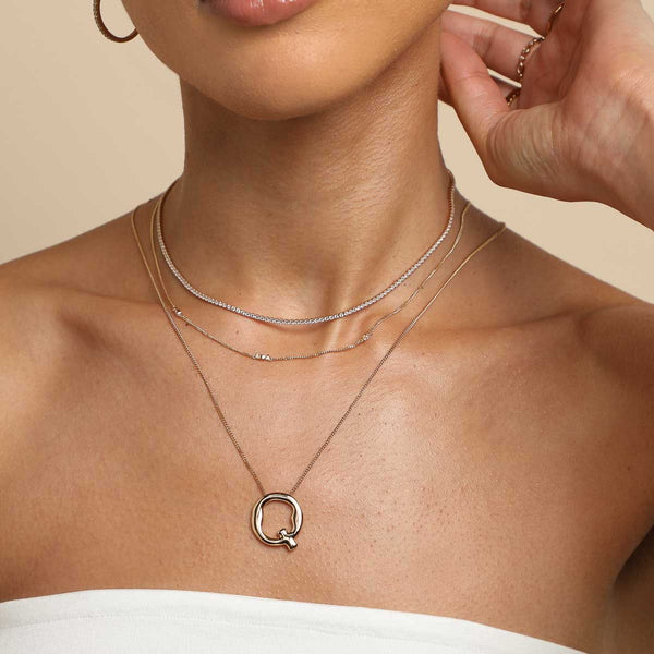 Astrid & Miyu Q Initial Bold Pendant Necklace In Gold