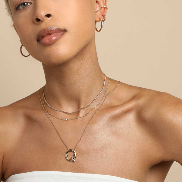 Astrid & Miyu Q Initial Bold Pendant Necklace In Gold